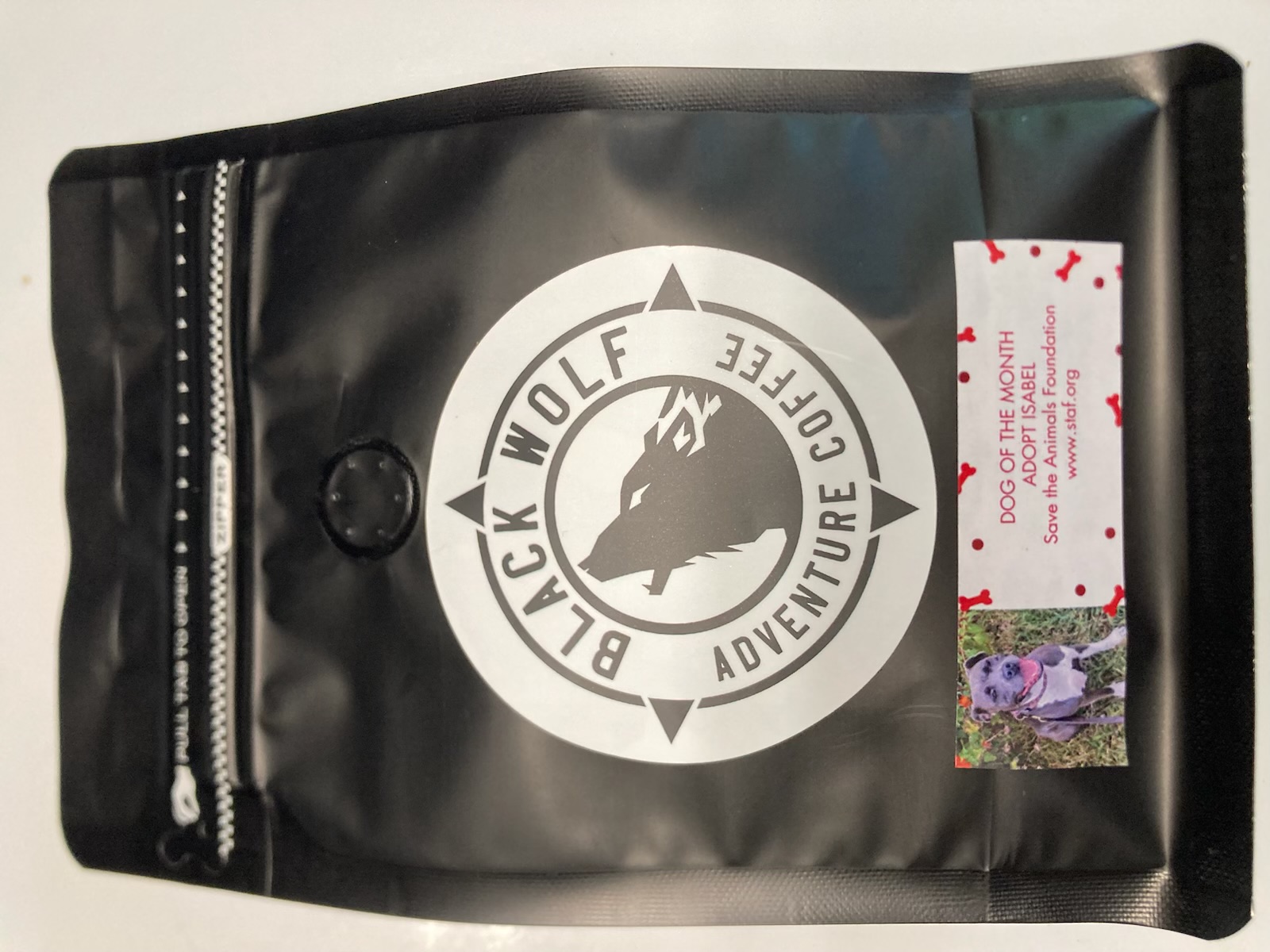 Black Wolf Adventure Coffee bag featuring a rescue dog